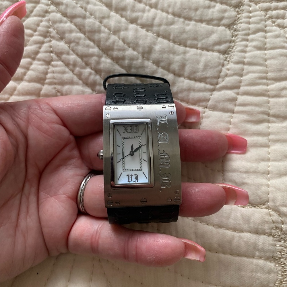 LAMB watch with black leather band. Works great but needs battery.